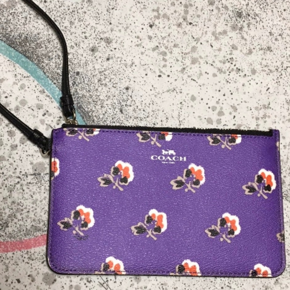 SOLD. Coach purple flower wristlet